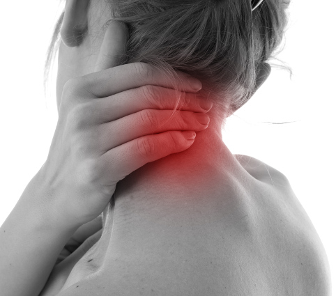 woman holding neck and in pain